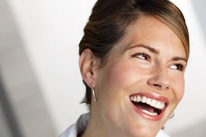Invisalign-Business-Woman-Blue-Jacket-Hair-Up-Orthodontics-Dentist-Essendon-Melbourne Beautiful smile thanks to Invisalign clear braces