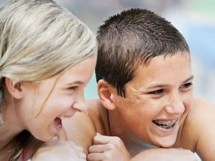 traditional metal braces worn by Melbourne smiling kids in pool orthodontics Essendon clinic traditional metal braces worn by Melbourne smiling kids in pool orthodontics Essendon clinic