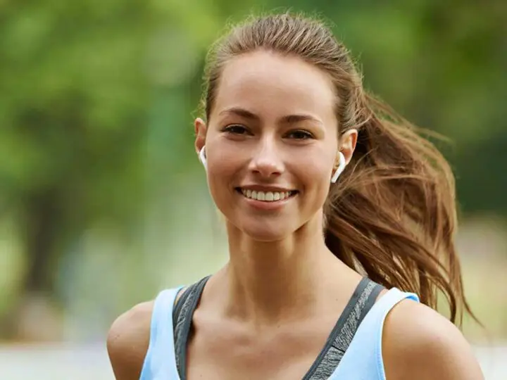 benefits composite veneers Essendon dental clinic Melbourne happy patient running with perfect smile