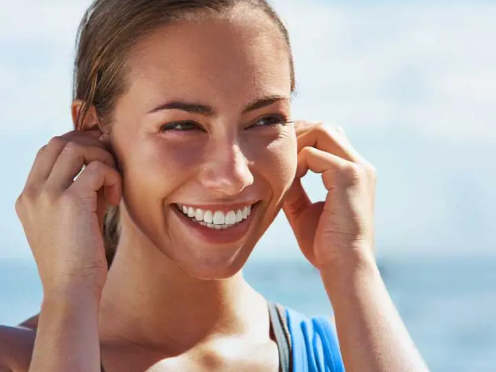 composite veneers Essendon dental clinic Melbourne happy patient exercising with beautiful smile